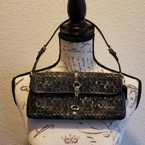 - Black shoulder clutch coach purse.